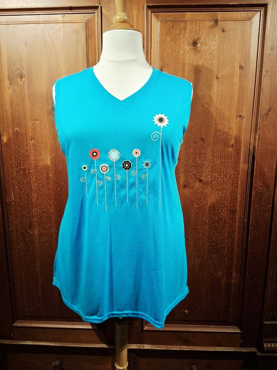 mooie top turquoise met bloemen 50-52